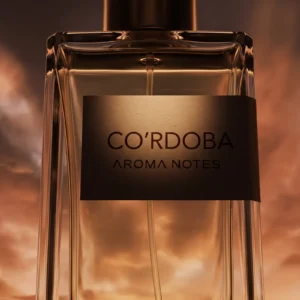 Aroma Notes Cordoba perfume bottle against a dramatic desert sunset sky